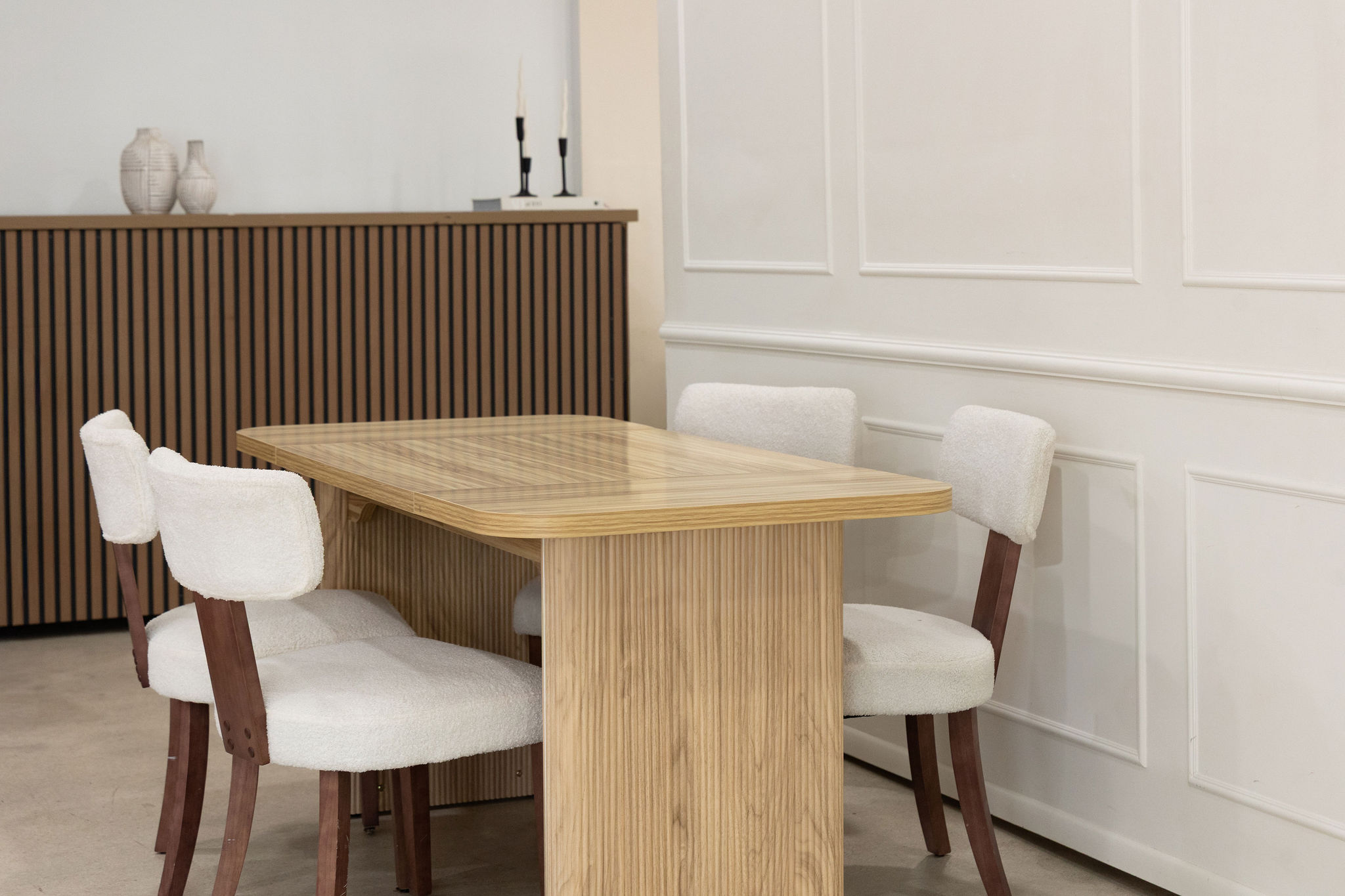 Sculptural white cyclorama backdrop at a Miami photography studio, clean minimalist set for shoots