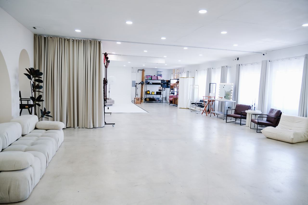 Private photo studio floor near Coconut Grove with styled sets and glam station